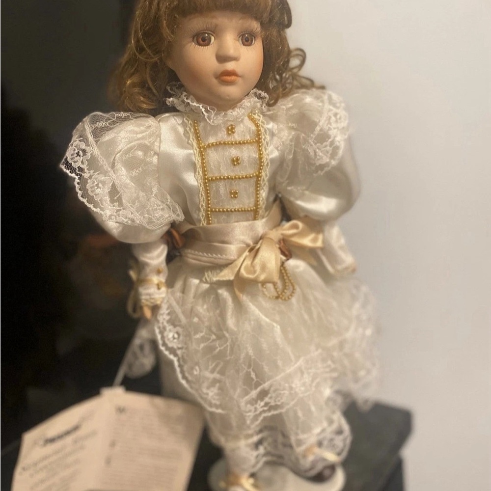 Elegant Porcelain Doll in White Lace Dress
